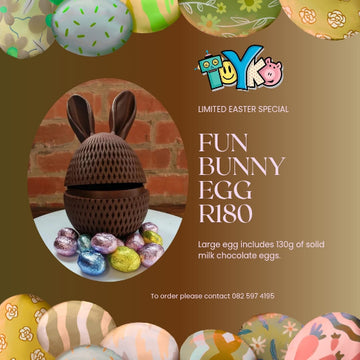 Promotional image of a chocolate egg with bunny ears, surrounded by Easter eggs, on a brown background with 'Toyko' branding.