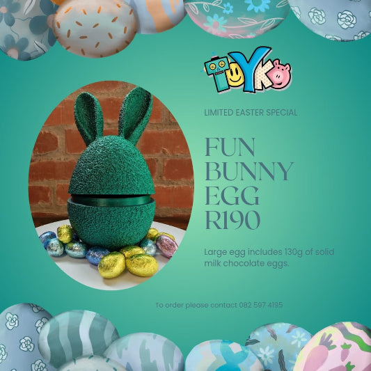 Promotional image of a chocolate egg with bunny ears, surrounded by Easter eggs, on a green background with 'Toyko' branding.