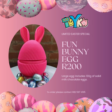 Promotional image of a chocolate egg with bunny ears, surrounded by Easter eggs, on a pink background with 'Toyko' branding.
